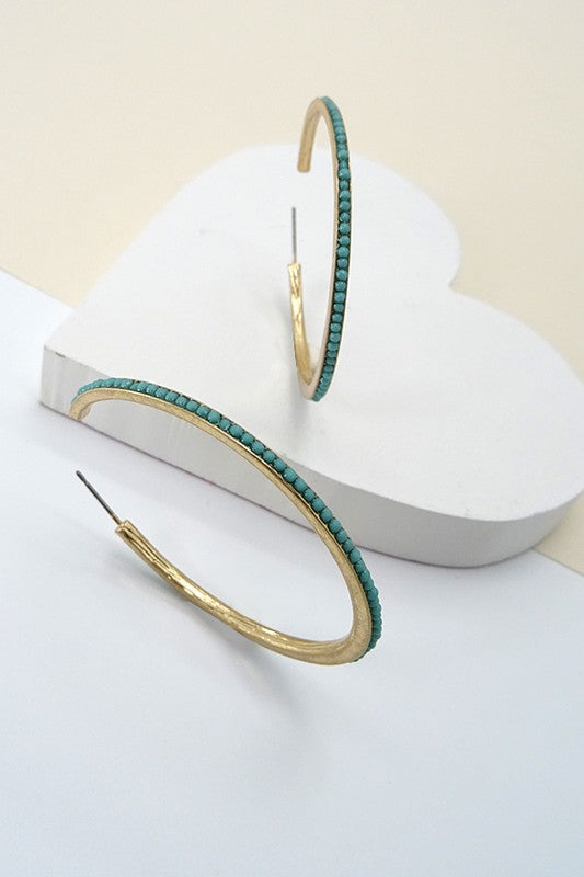 Turquoise beaded hoop on worn gold